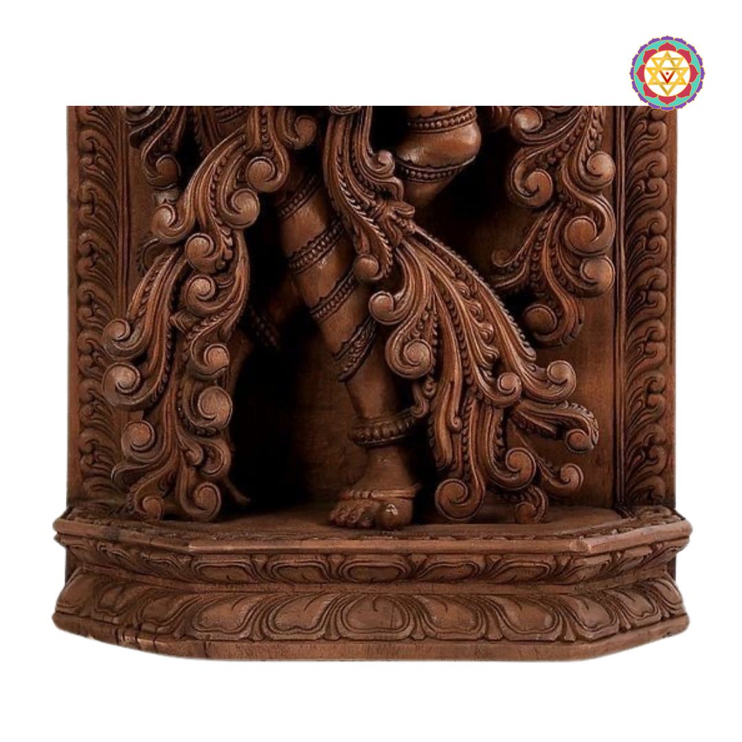 Carved wooden statue with intricate designs on a white background - Footwork and base carving of Krishna panel