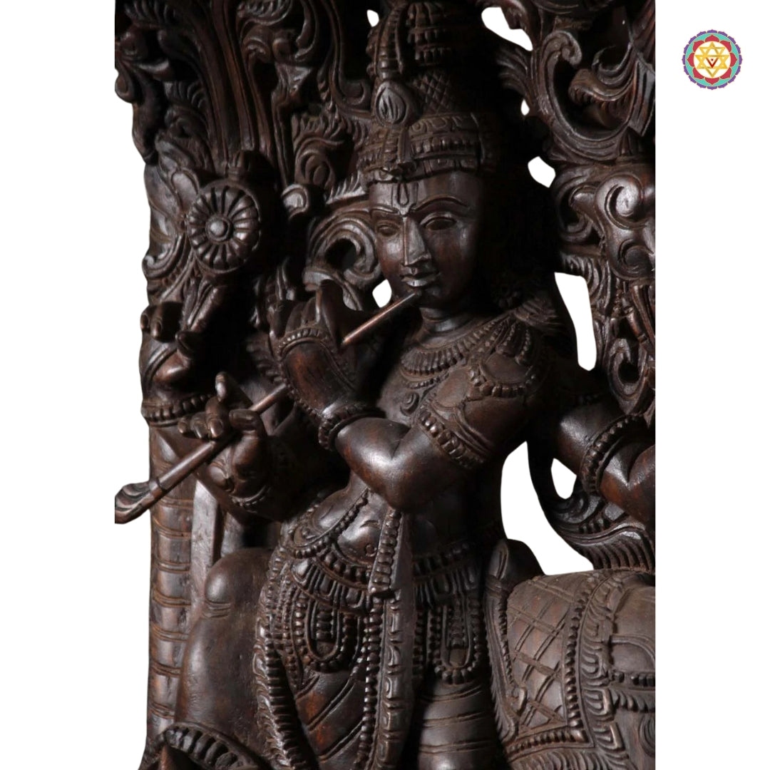 Close-up of Krishna’s face and flute carving