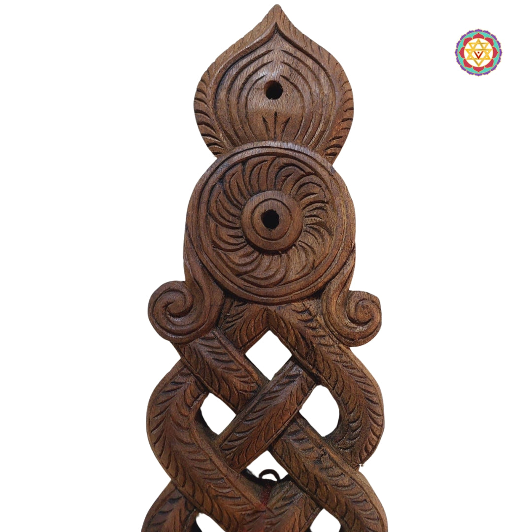 Close-up of bird wooden figurines on spoon handle