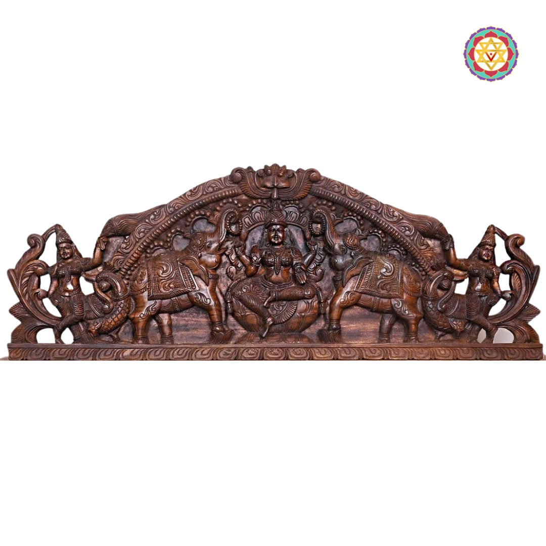 Side profile showing Gajalakshmi and floral border carvings