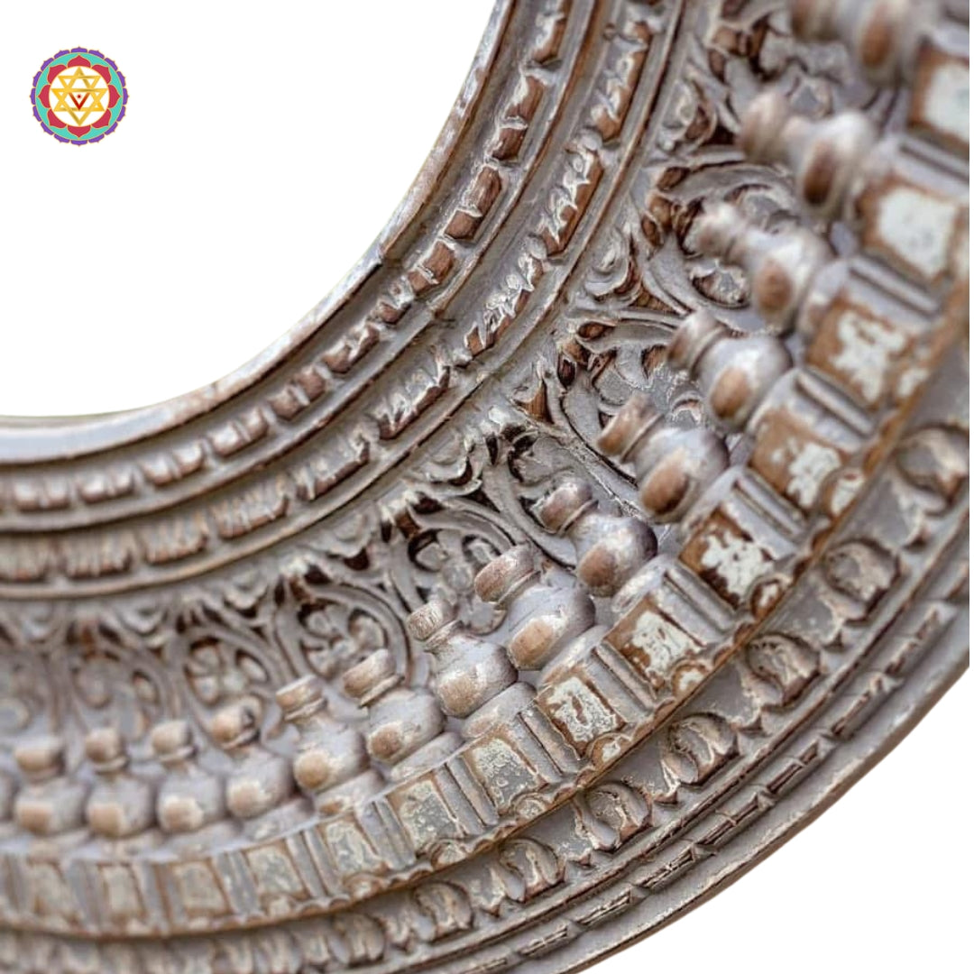 Carved pattern close-up on round mirror frame