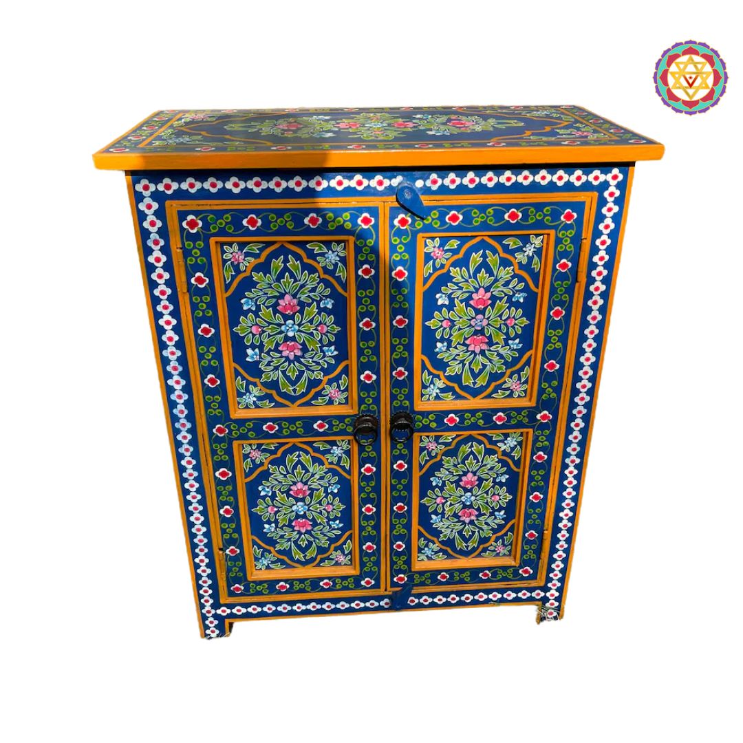 close-up of floral motifs on painted wooden storage cabinet