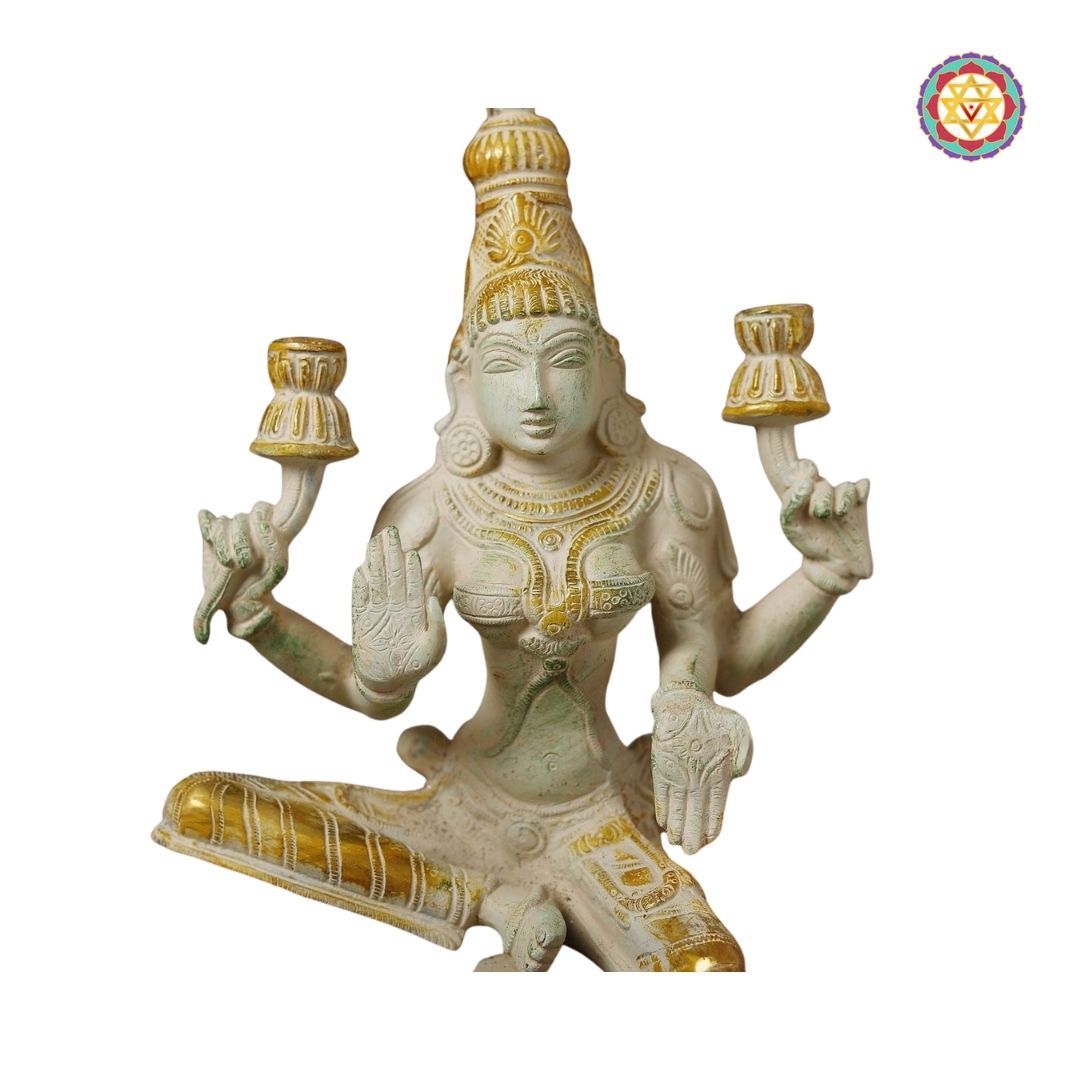 full view of white and gold Lakshmi statue in elegant posture