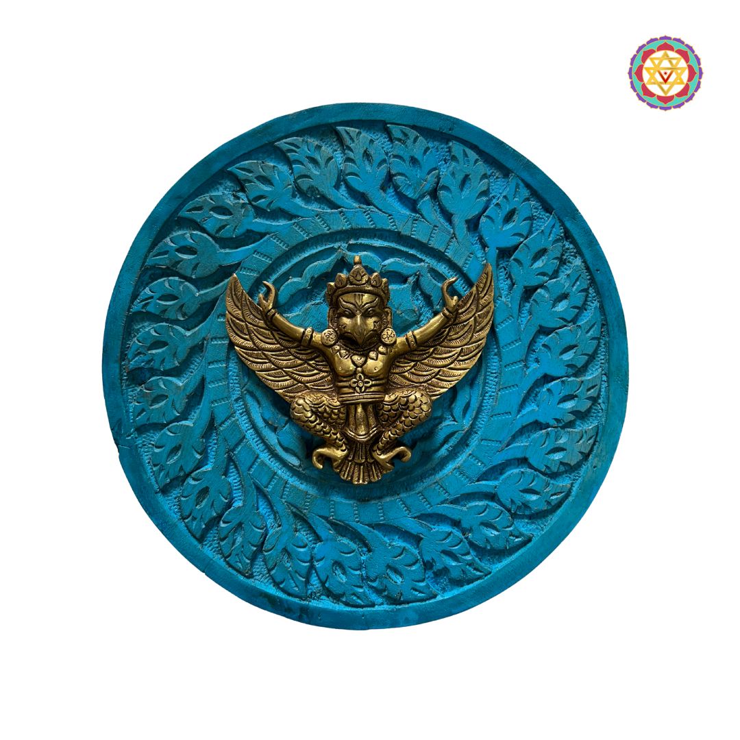 Side angle showing depth and detailing of the brass Garuda and woodwork