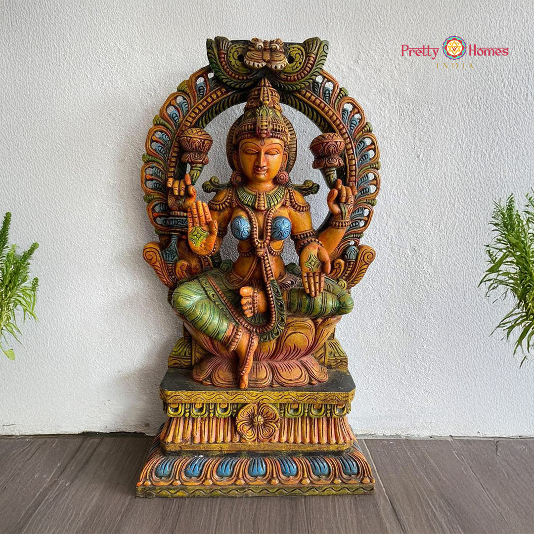 hand-carved goddess lakshmi statue in abhaya mudra with mythical yali