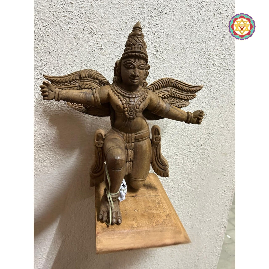 divine garuda statue in natural wood finish for temple decor