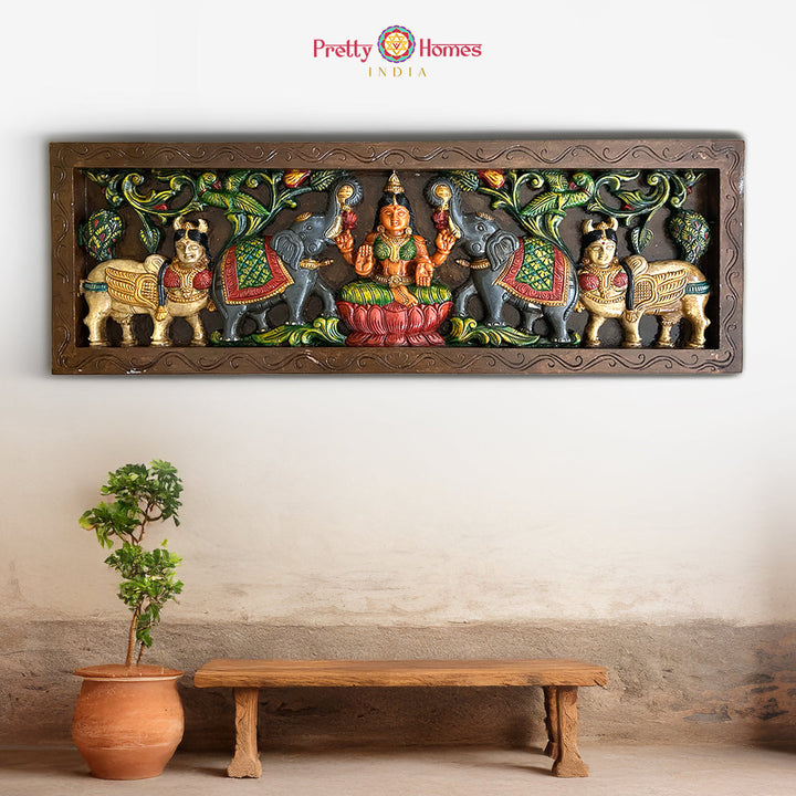 Gajalakshmi wooden wall panel with Kamadhenu and elephants
