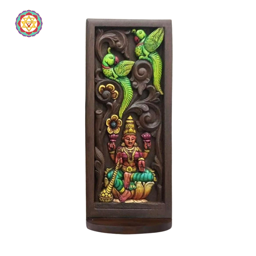 handcarved wooden lakshmi panel featuring lotus and colourful parrots