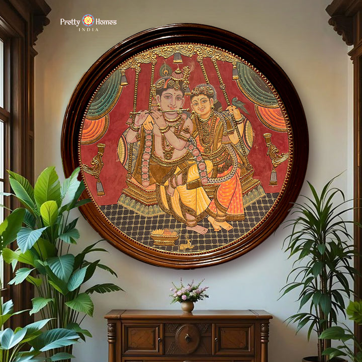 Vintage style Round Handmade Tanjore – Flute Krishna with Radha on Swing | 24K Gold & Teakwood Frame