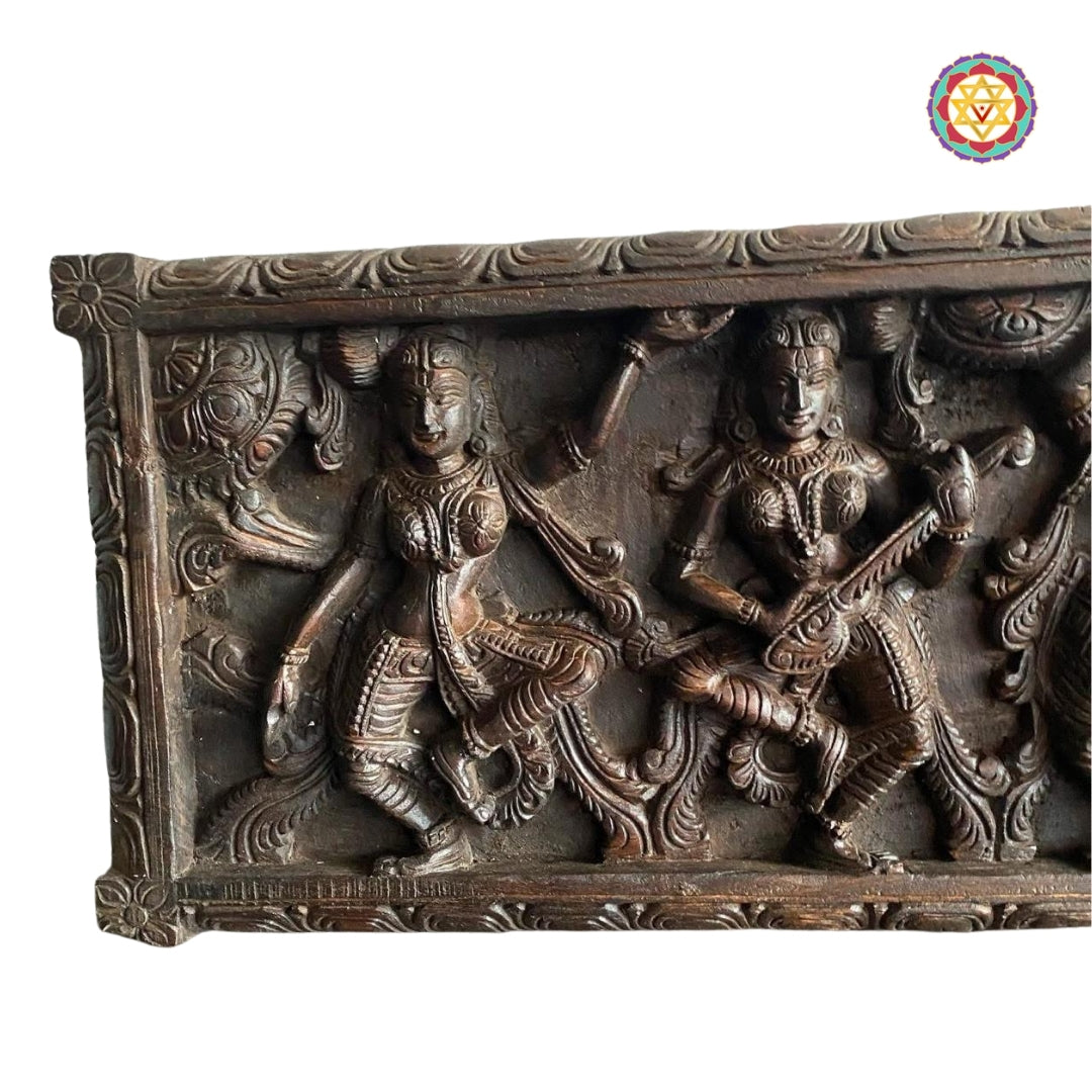 Detailed view of Vagai wood carving of divine musicians