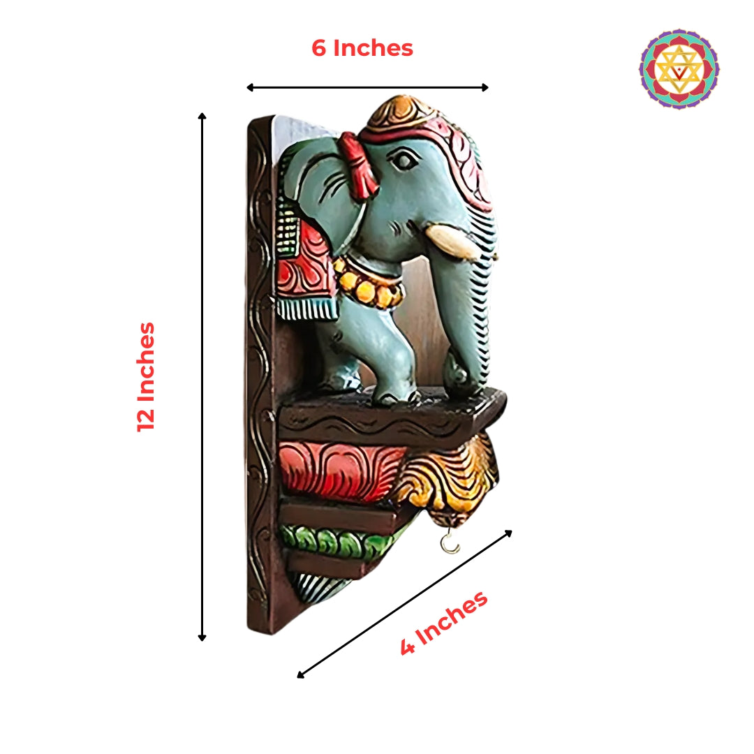 Hand-painted wooden elephant wall corbel with size markings and colourful motifs.