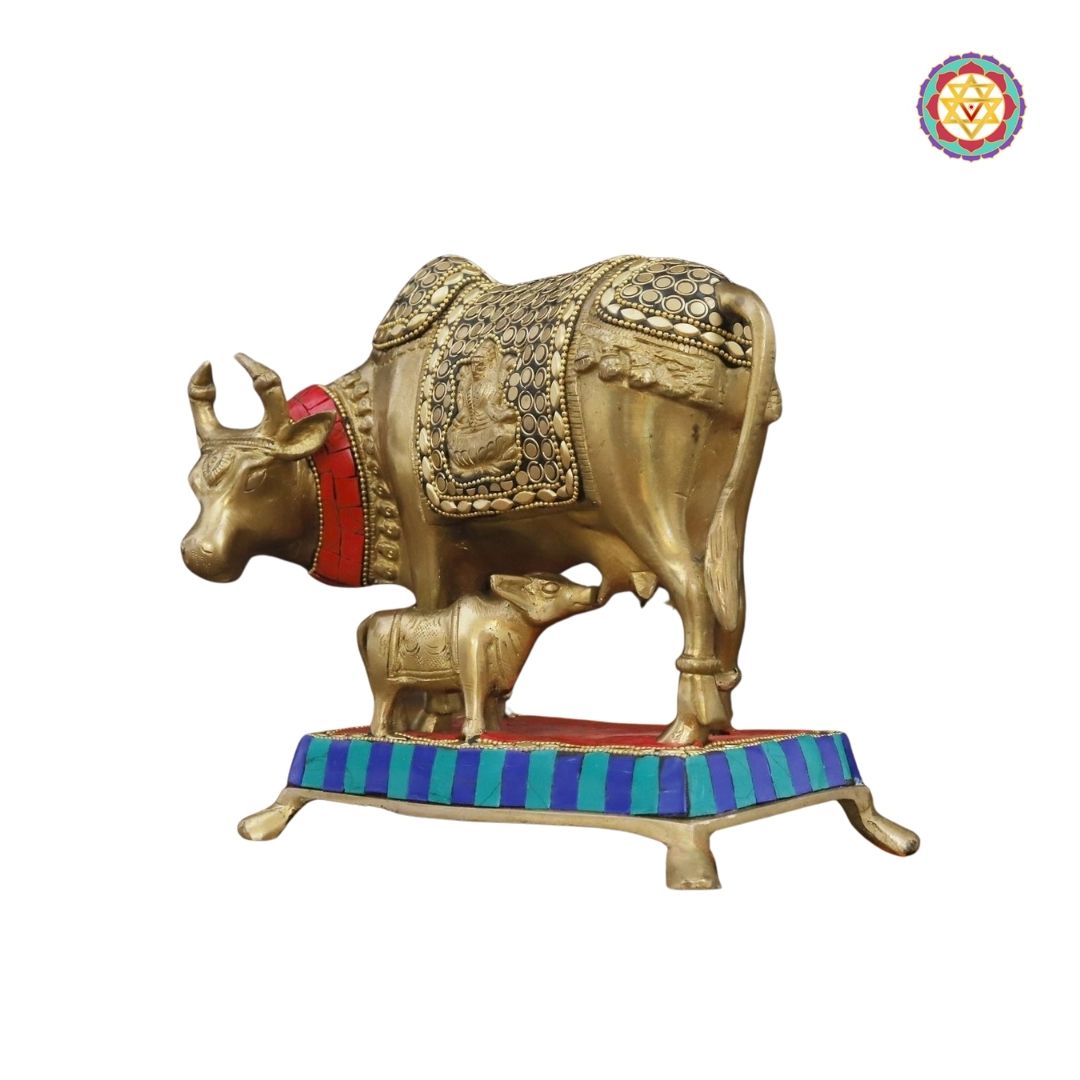 handcrafted brass Kamdhenu cow and calf idol with golden finish and stone detailing