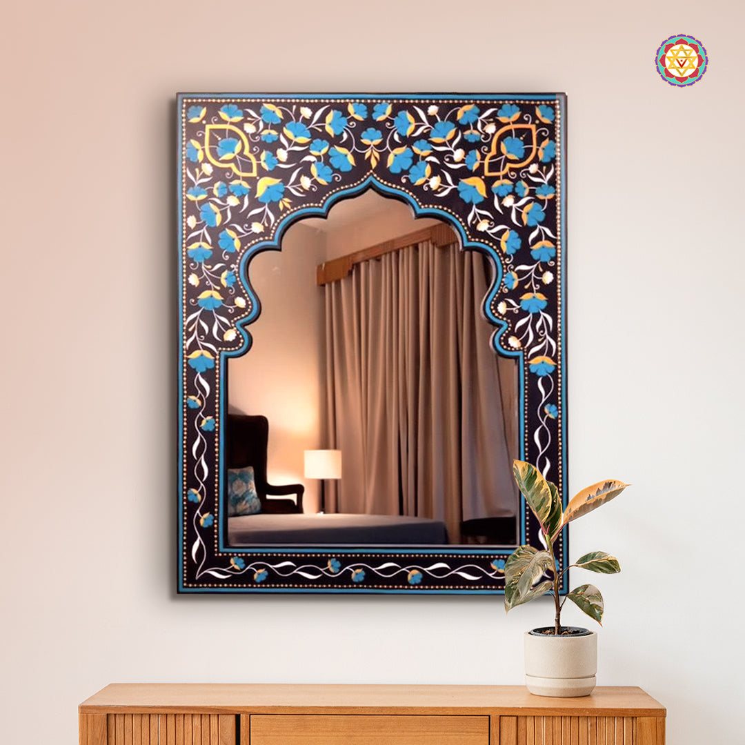 Handpainted wooden mirror frame mounted on a wall