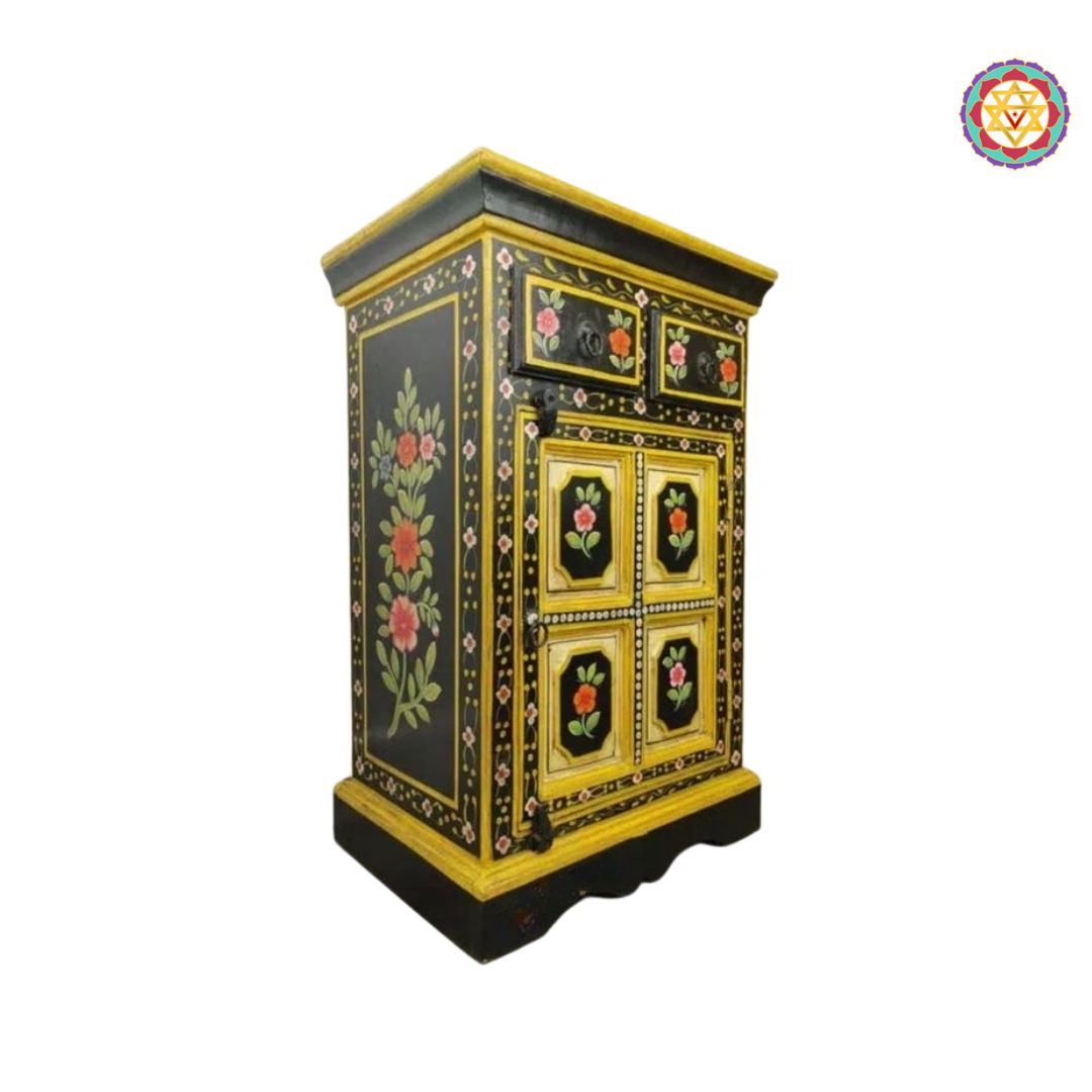 side view of small wooden cabinet with decorative art