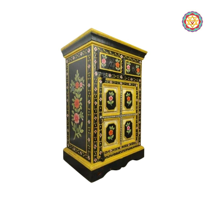 side view of small wooden cabinet with decorative art