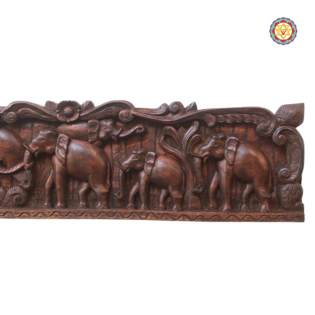 Side view of elephant carvings