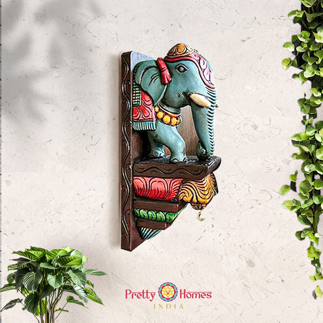 Hand-painted wooden elephant wall corbel with multicolour finish and ornate carved shelf.