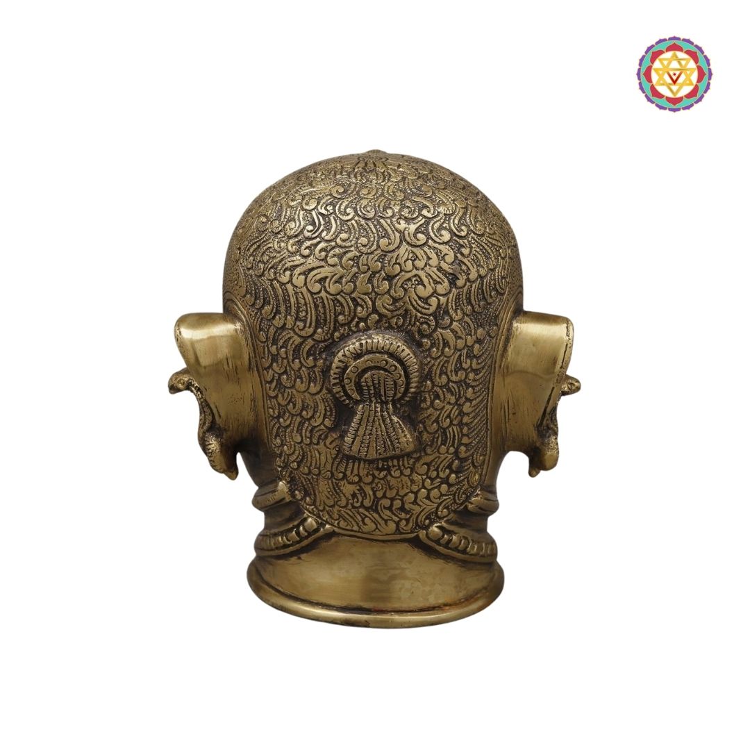 angled shot revealing crown and forehead carvings