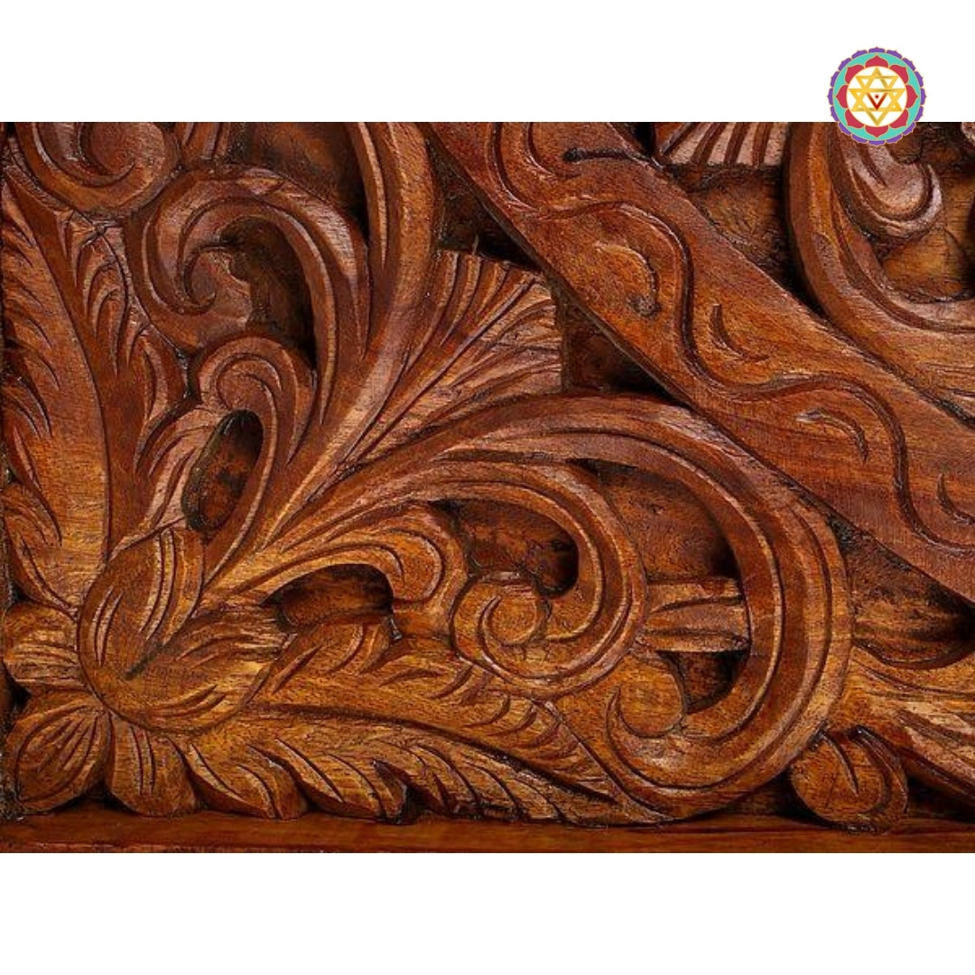 Angled shot highlighting handcrafted detailing in lotus carving