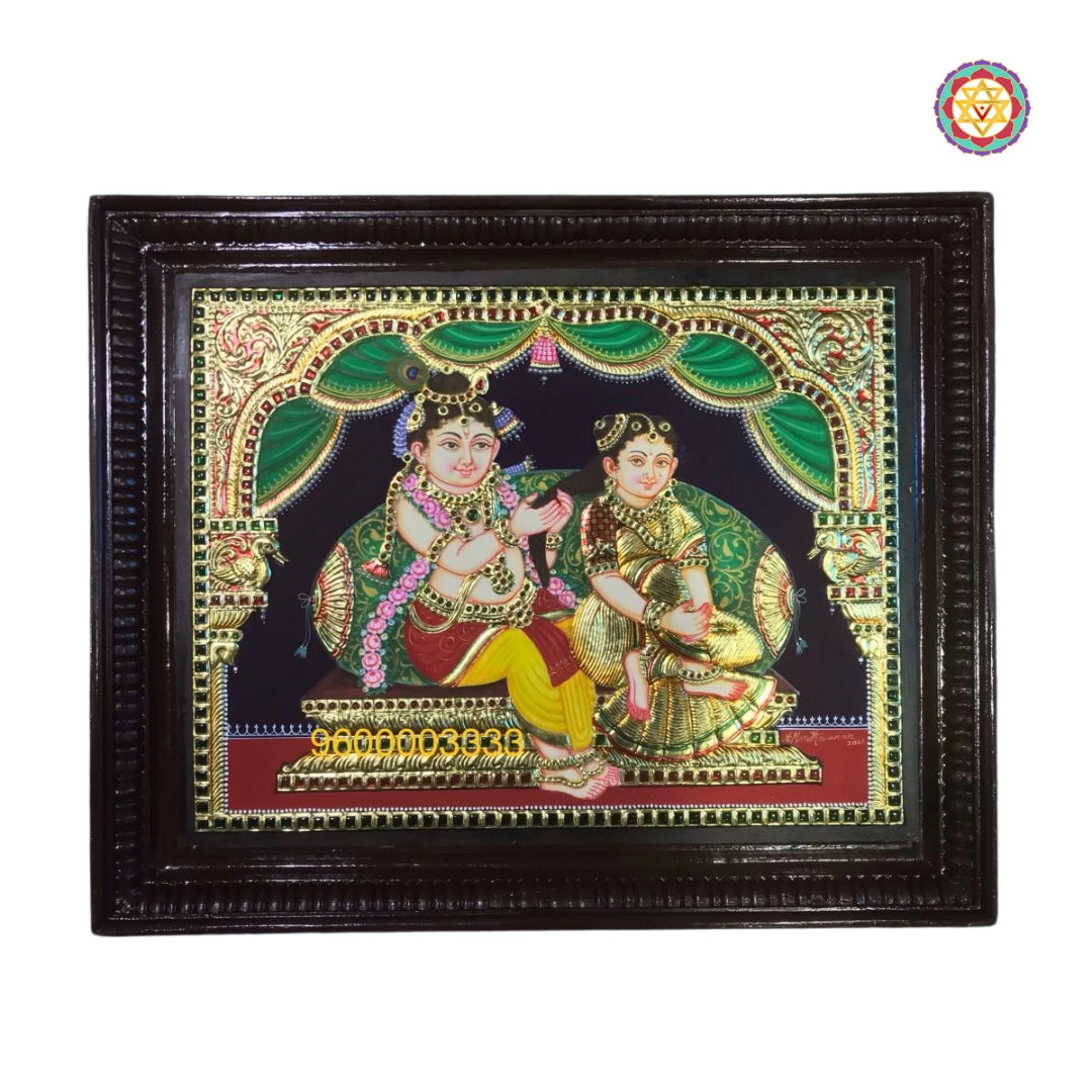 Close-up of Krishna and Radha seated under ornate arch in traditional Tanjore painting style