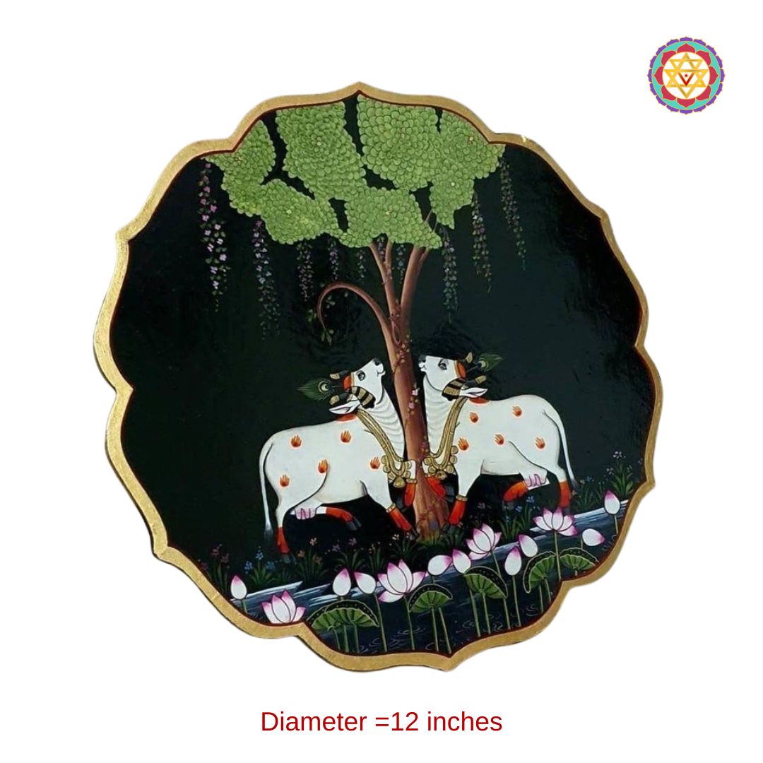 hand-painted petal-shaped pichwai wall plate depicting cows under the tree of life, symbolic and artistic design