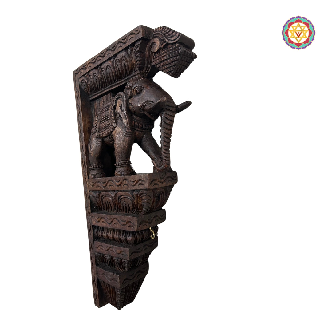 Side view of elephant bracket showing detailed floral carvings