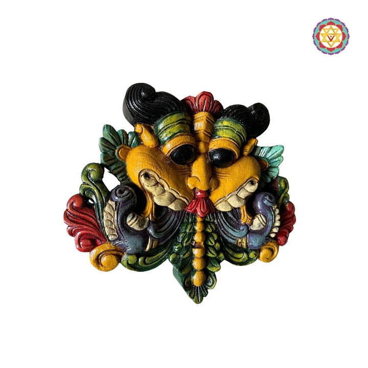 Close-up of Yali wall hanging mask in vibrant colors
