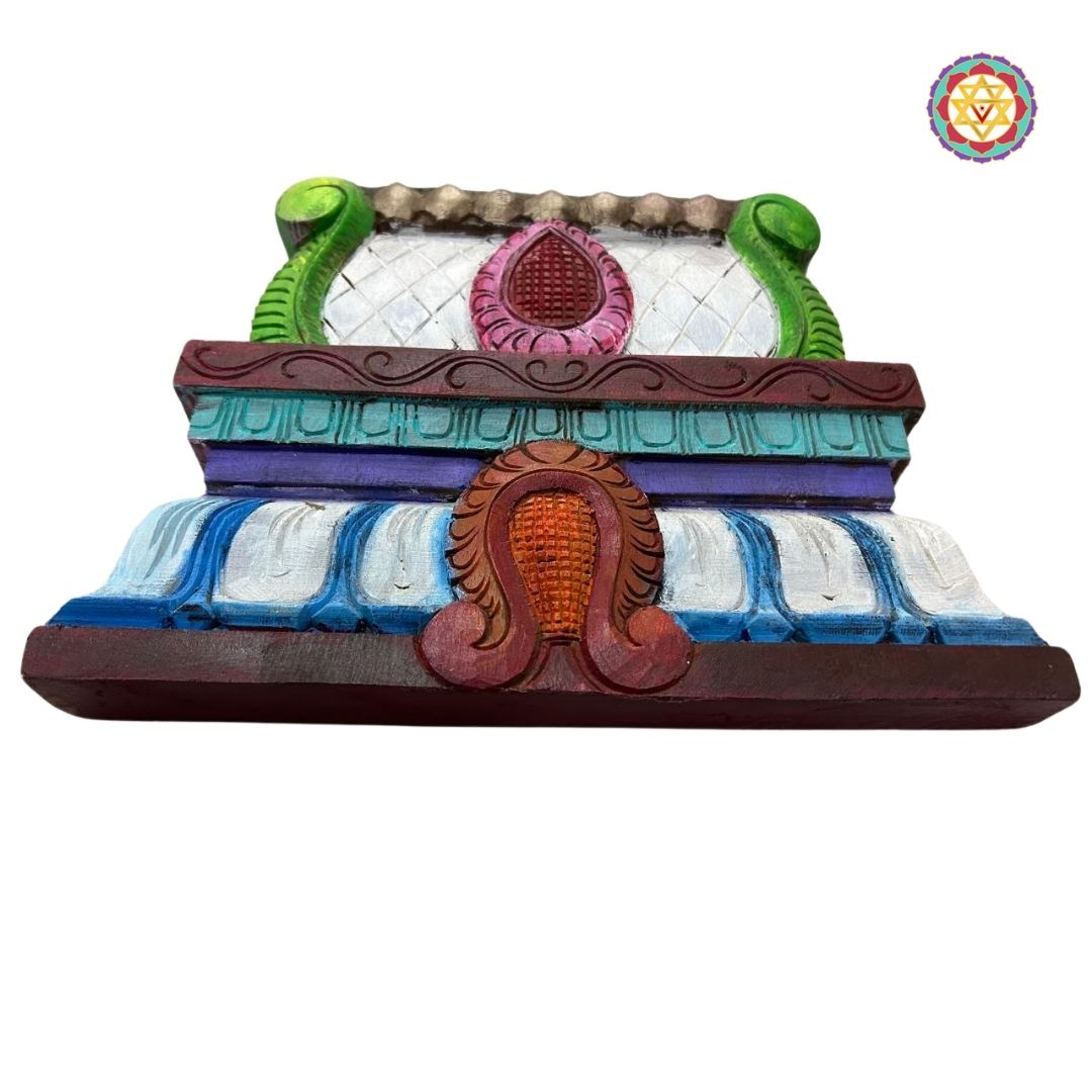 Close-up of decorative wooden gopuram wall hanging