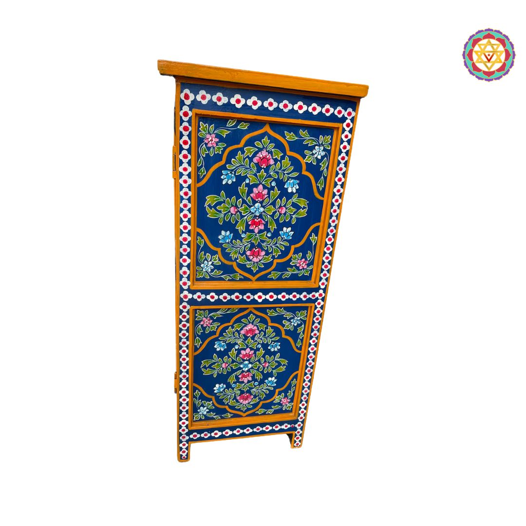 detailed artwork on wooden cabinet doors and drawers