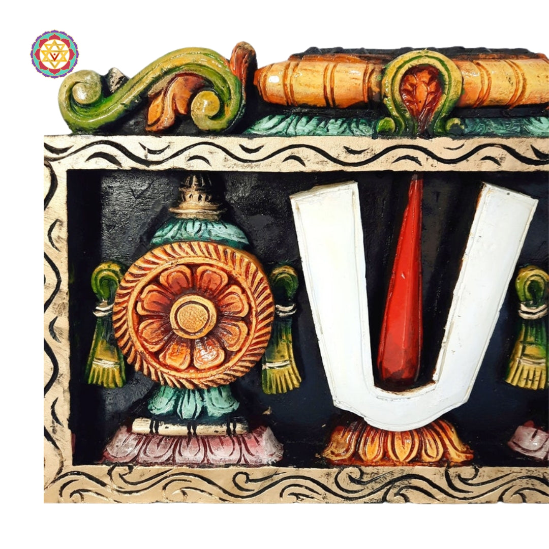 Close-up of Thiruman and Chakram carvings in Balaji wood panel