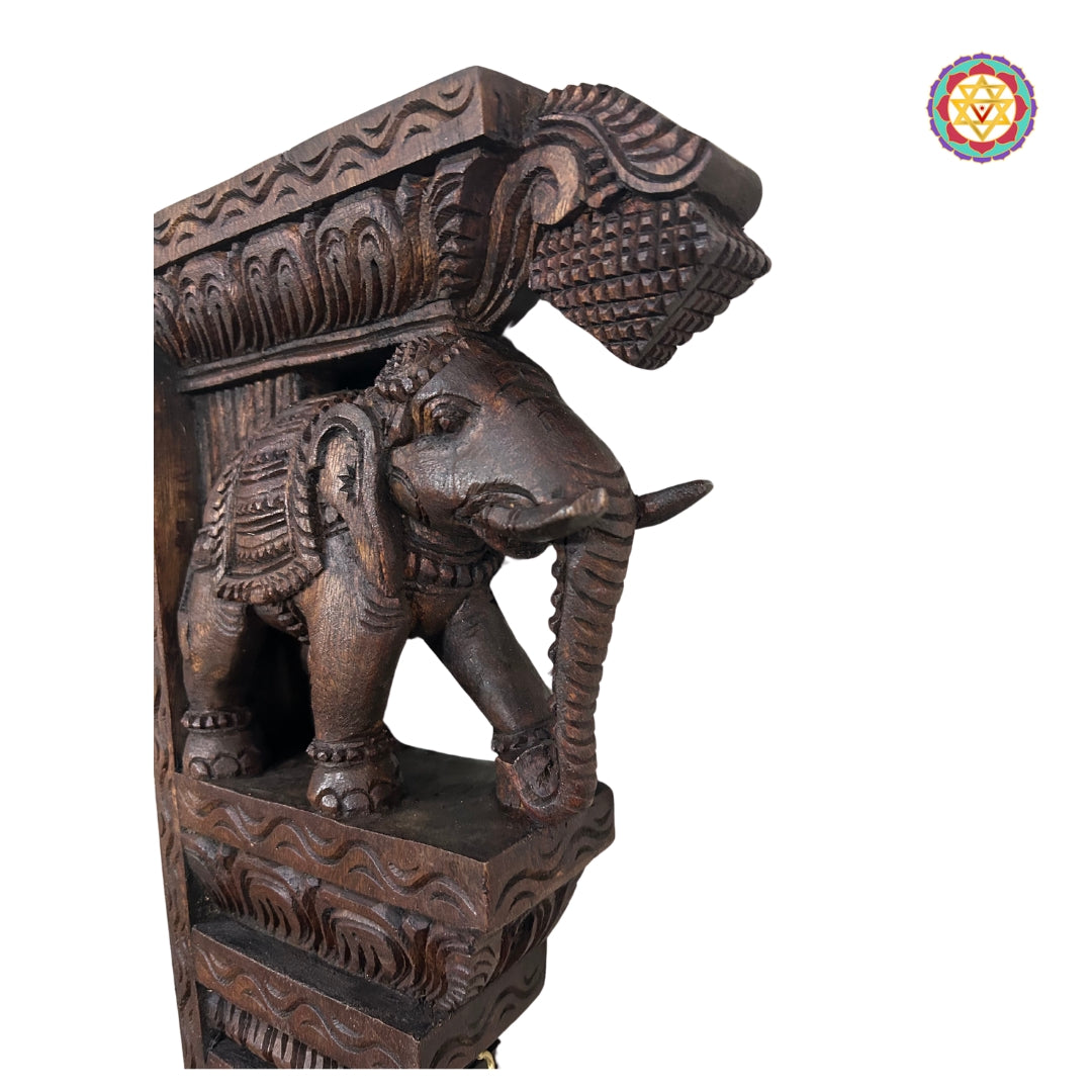 Close-up of handcrafted wooden elephant wall decor in vintage polish