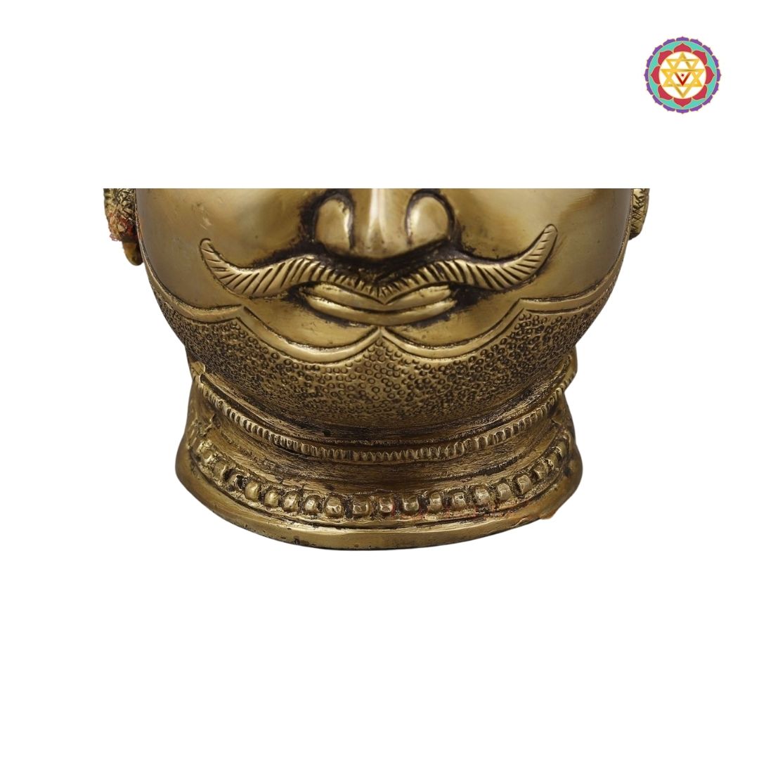 side-angle view showing textured golden surface and carved details