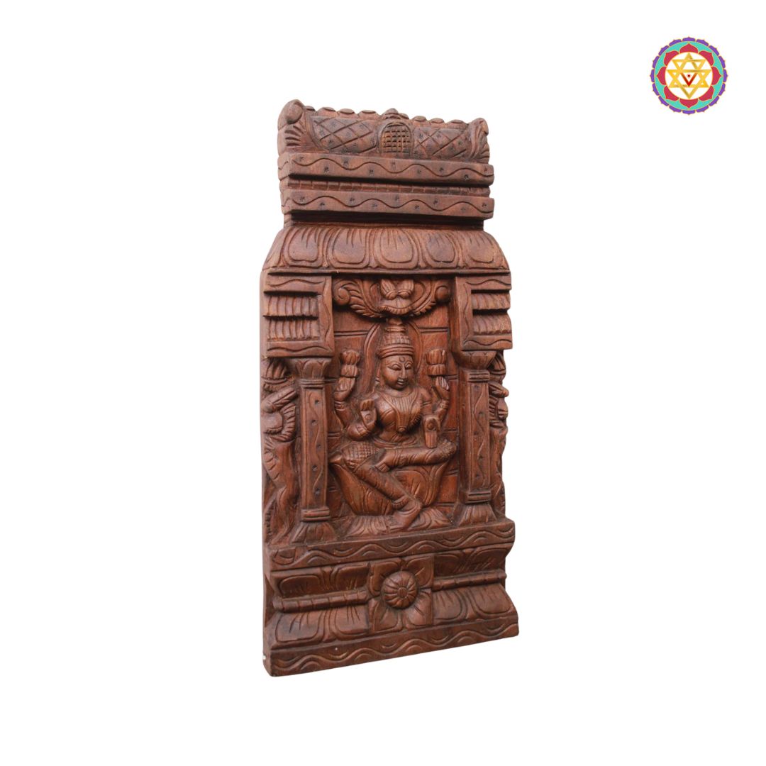 Wooden carvings with intricate designs on a white background: Side view of the carved wooden wall mount

