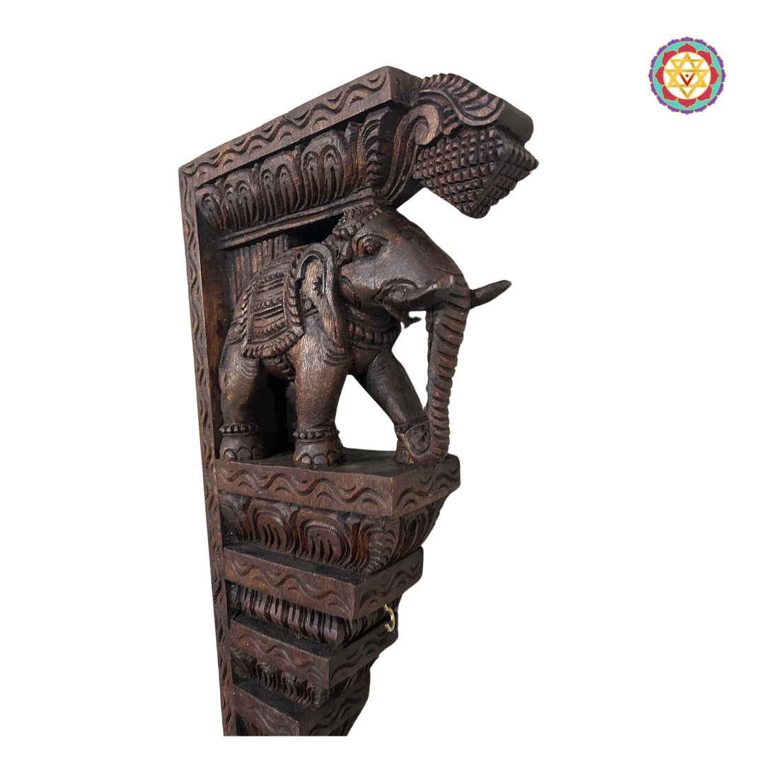 Artisan-carved elephant bracket with ornamental detailing and smooth polish