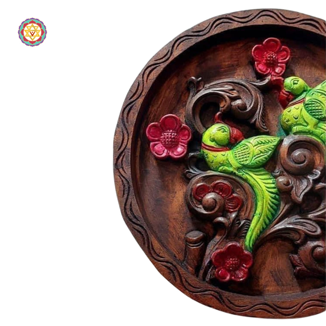 Round handcrafted wall plate with intricate parrot and flower carving