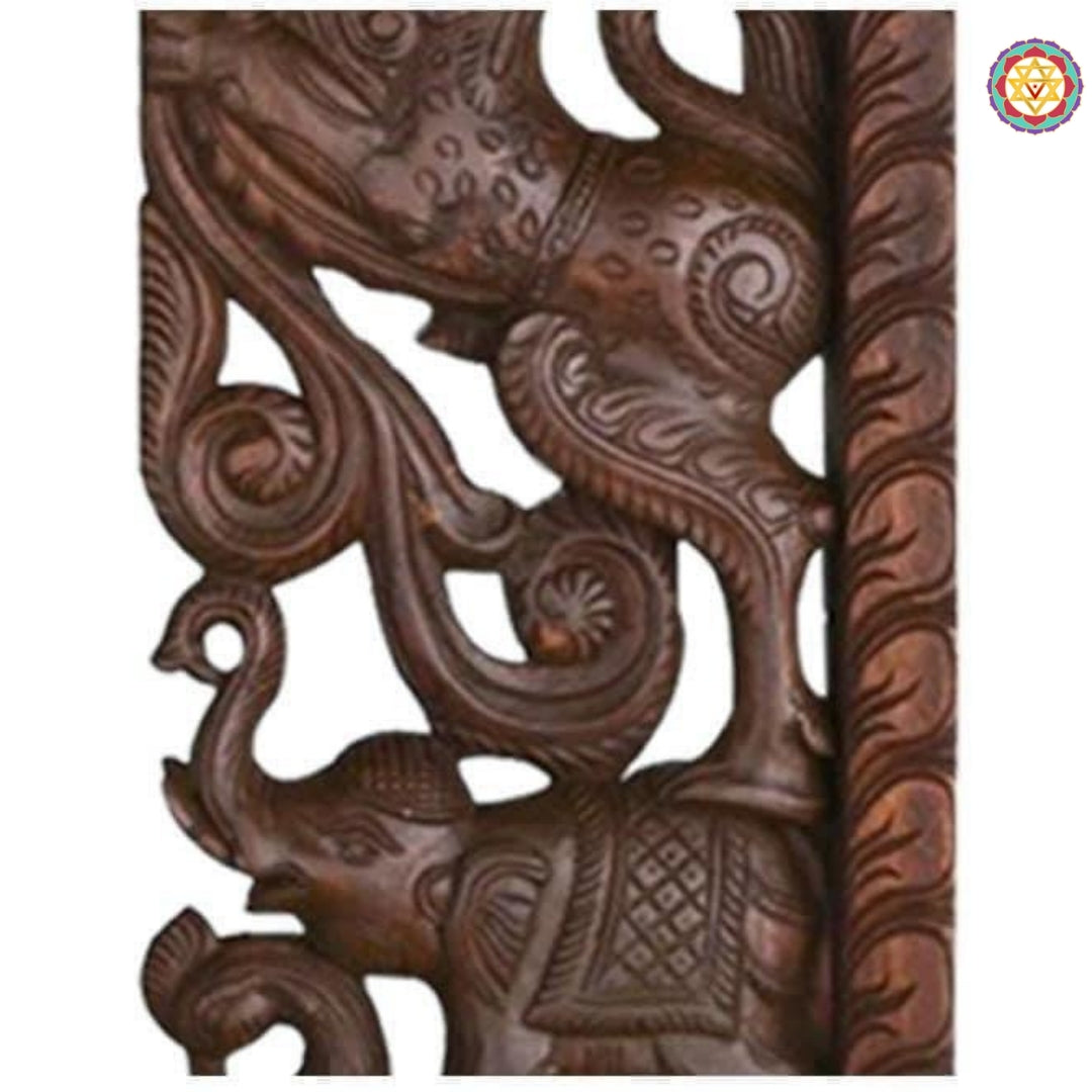 Detailed close-up of wooden Yali entrance bracket highlighting elephant head and floral scrollwork details