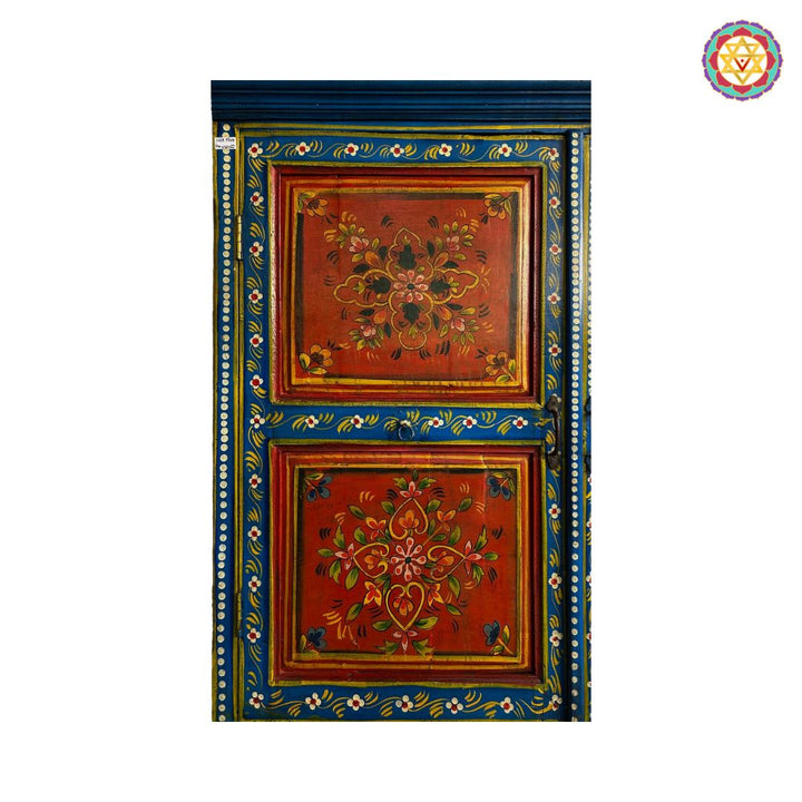 Close-up of carved floral motif detailing on cabinet