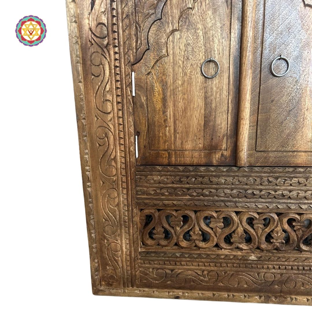 “Side view of the wooden jharokha window frame emphasizing the carved detailing.”