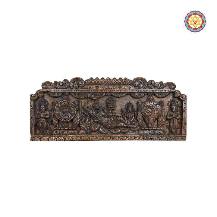 Decorative bronze panel with intricate carvings on a white background