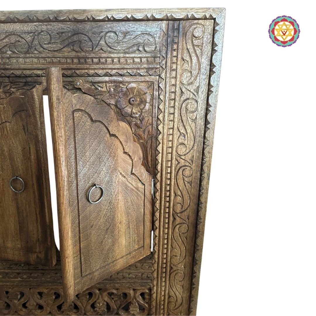 “Close-up of the carved wooden jrokha window frame highlighting intricate details.”

