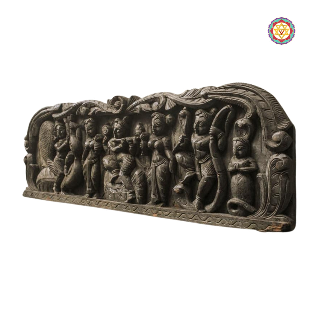 Side-angle view of Krishna wall panel with intricate carvings