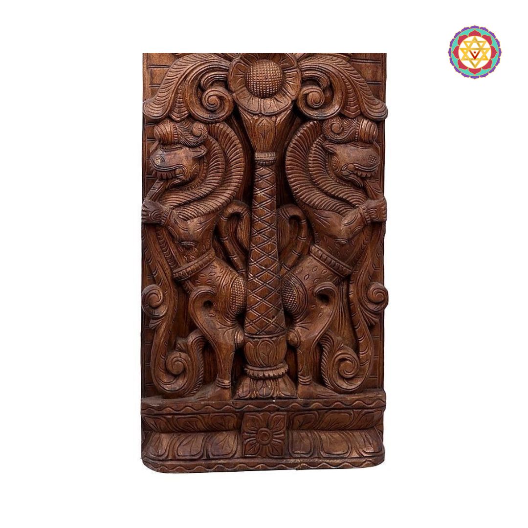 Carved wooden panel with intricate designs on a white background - Detail of Yali carving in traditional Indian wood style

