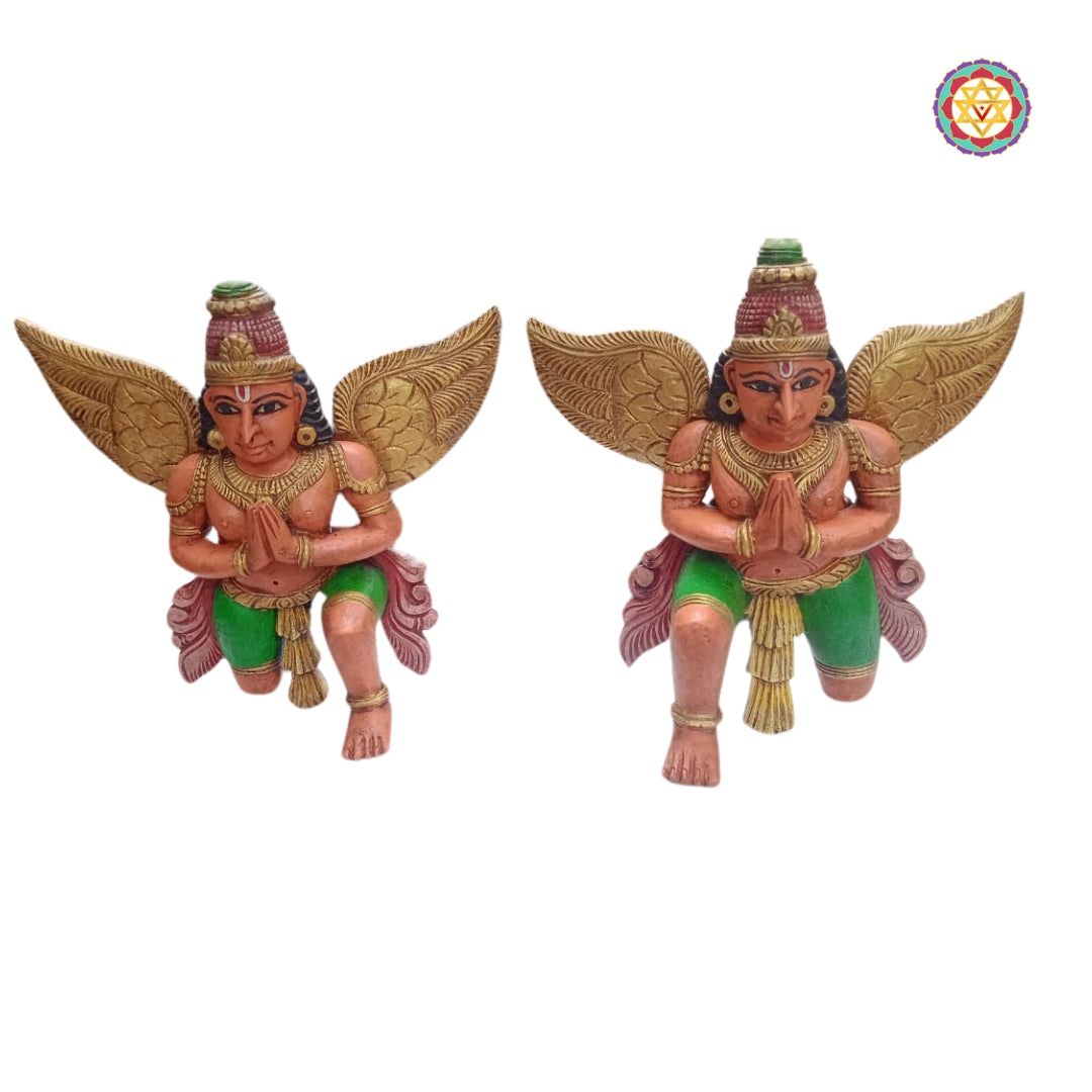 Angled view of Garuda meditating sculpture on carved pedestal — spiritual home decor accent with antique polish