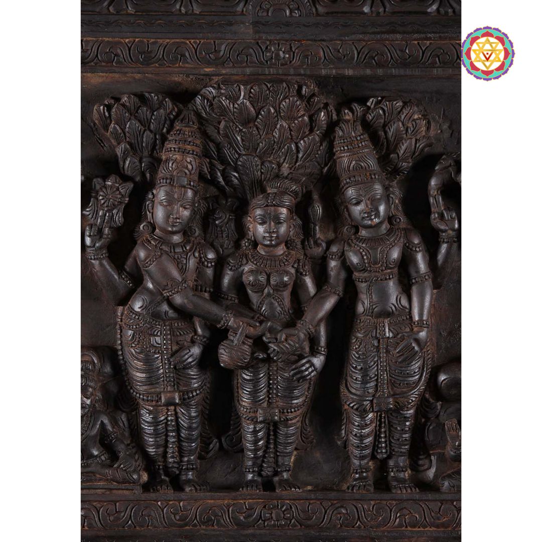 Detailed wooden carving of wedding ceremony elements