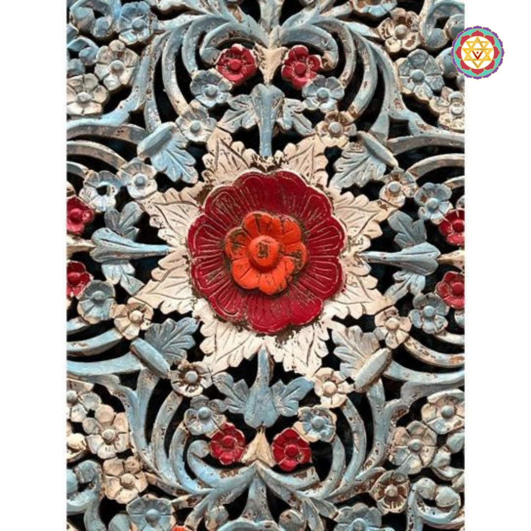 Close-up of red center floral motif in carved jali wall panel