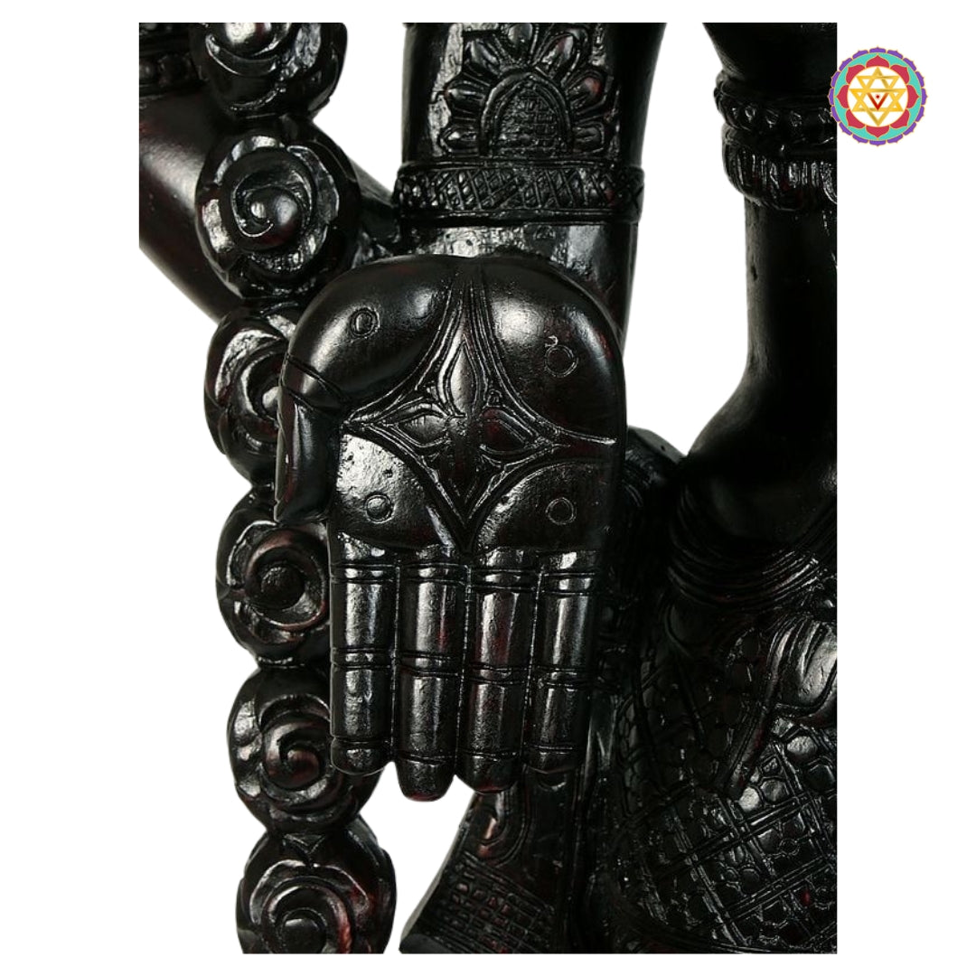 side angle of perumal balaji statue showcasing carved jewelry and frame