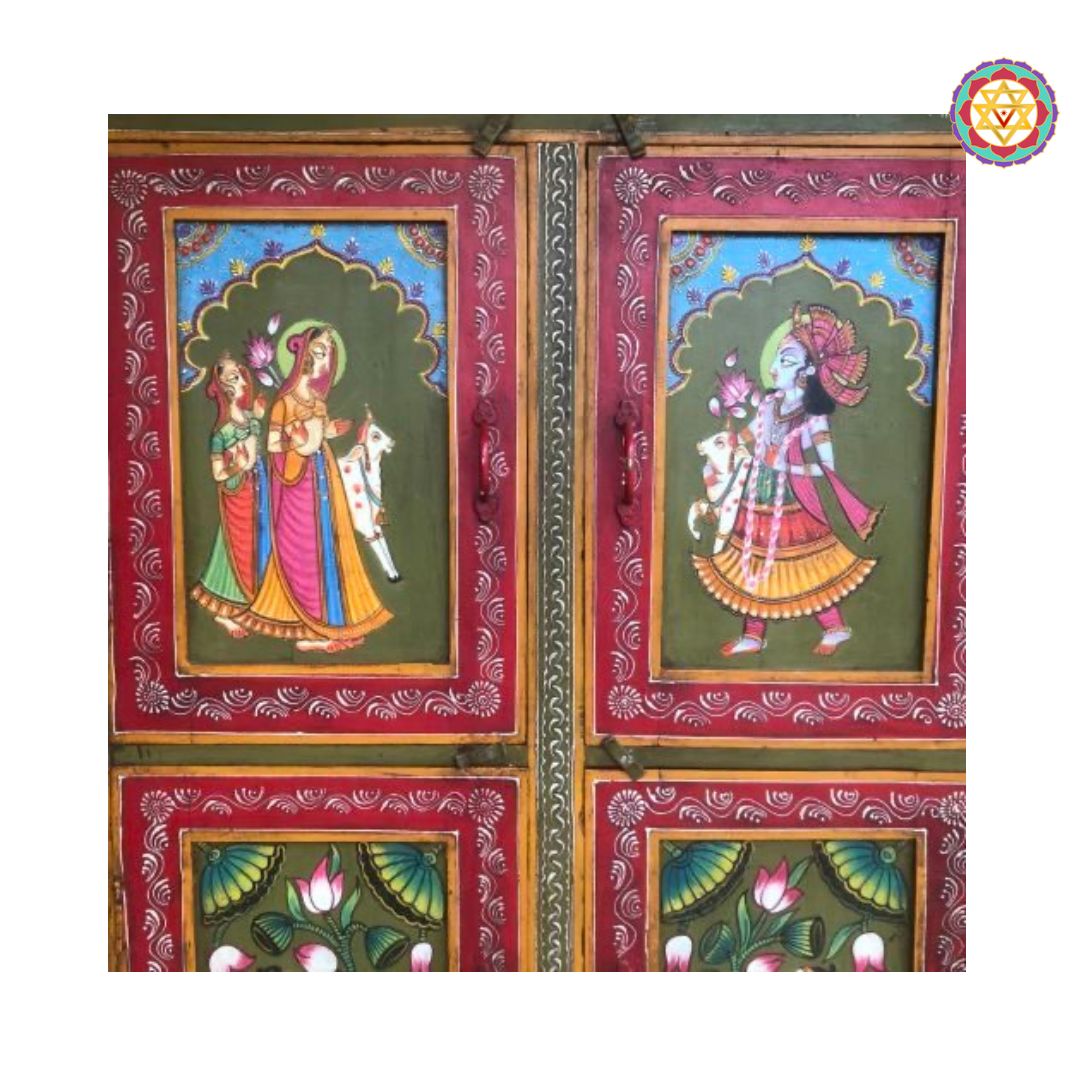 floral and figure details on vintage wooden cupboard