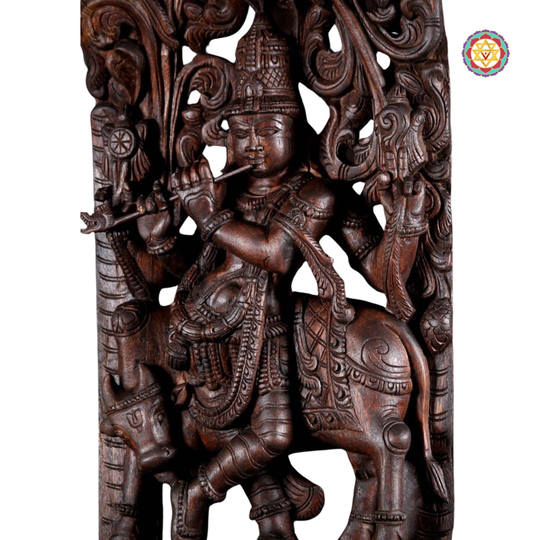 Handcarved Lord Krishna statue with cow beneath floral arch design