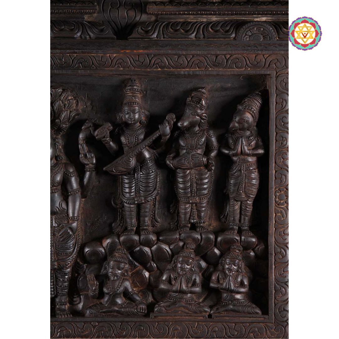 Side view of Vagai wood panel with intricate carvings