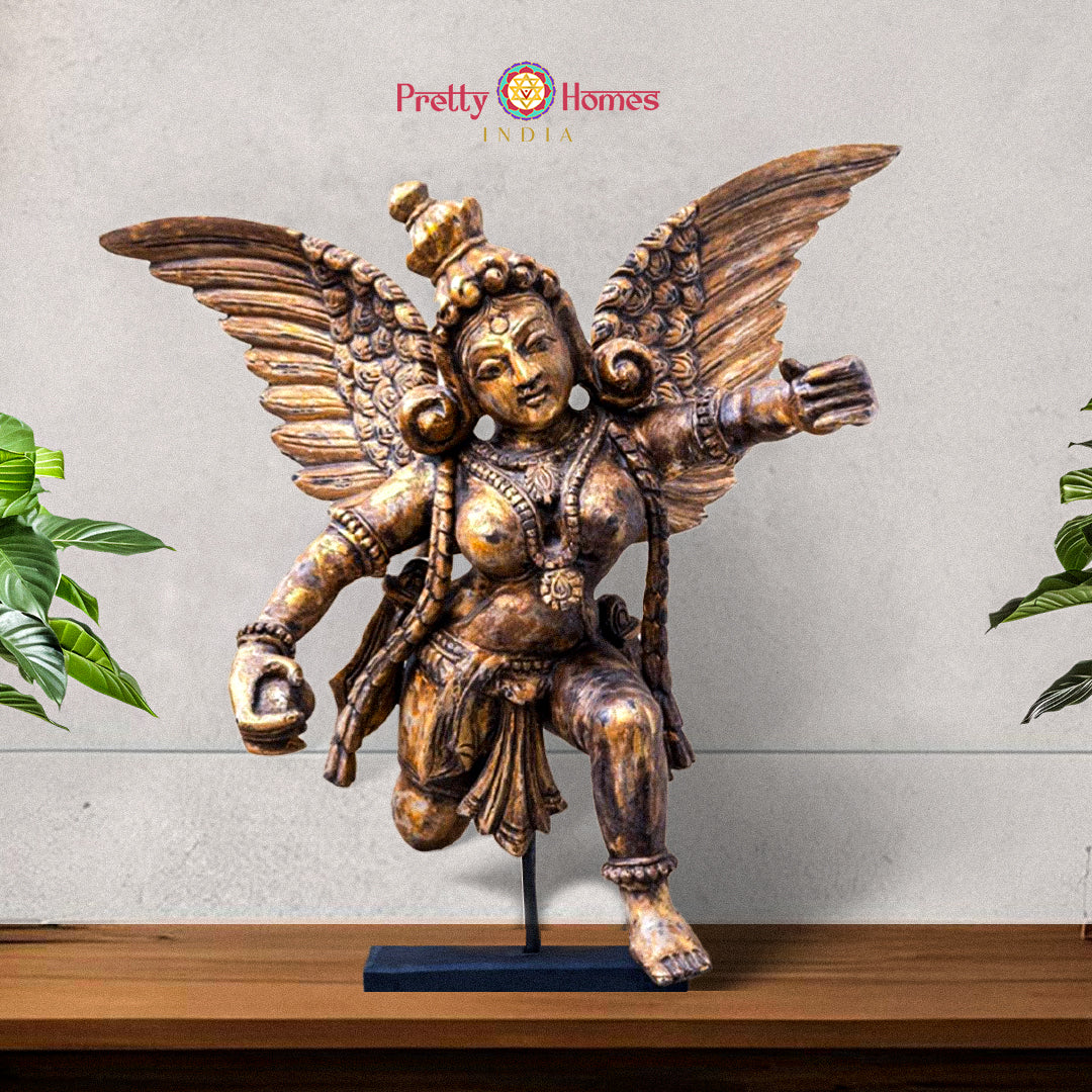 Front view of wooden Gandharva angel sculpture showing celestial figure with intricate carvings
